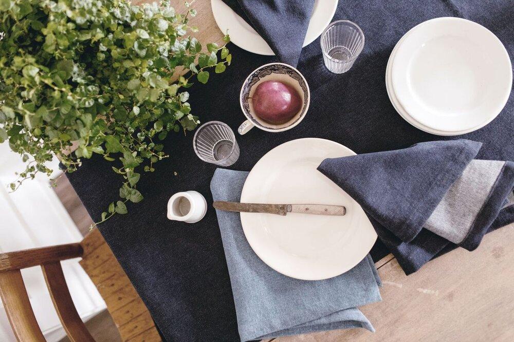 table setting with denim napkins and runner